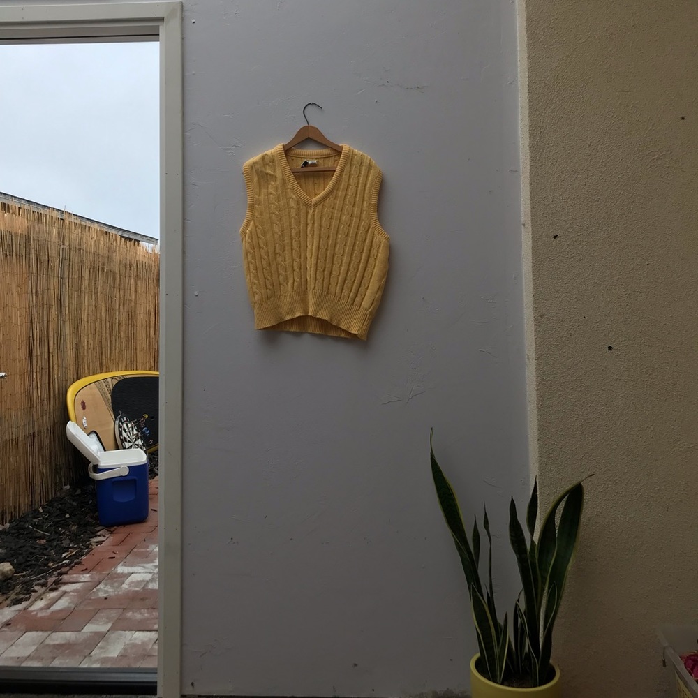 Yellow sweater vest
